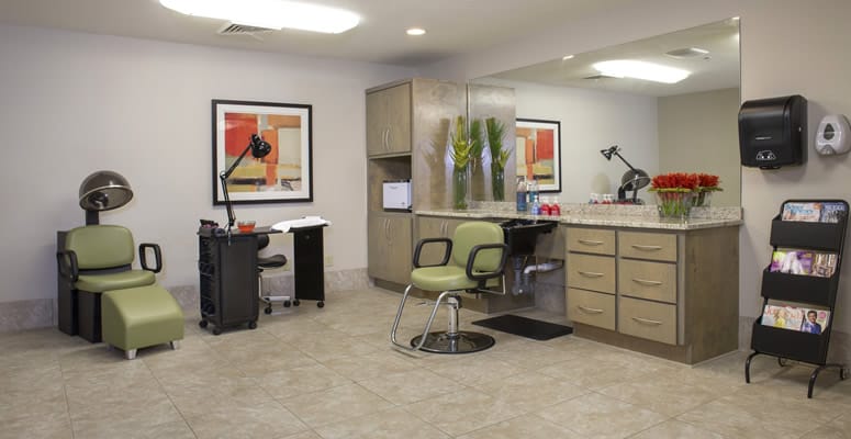 Hair salon area with styling chairs and equipment