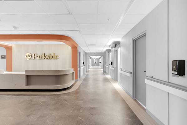 Bright corridor with reception area and logo