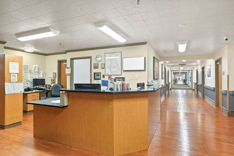 Interior view of a hallway with an office reception