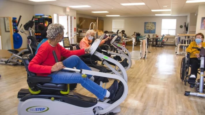 Residents engaged in exercise activities in the facility's gym