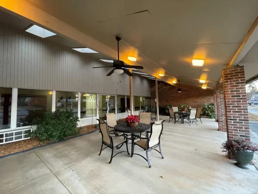 Outdoor patio area with seating and plants
