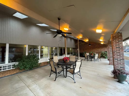 Outdoor patio area with seating and plants