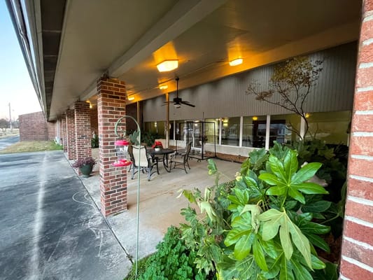 Outdoor patio area with seating and plants