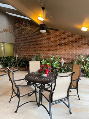 Outdoor seating area with a table and plants