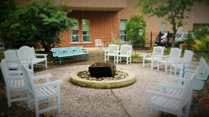 Outdoor seating area with a fire pit and chairs