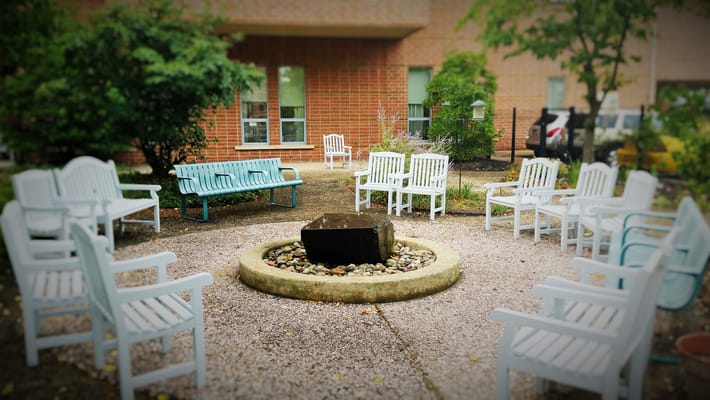 Outdoor seating area with a fire pit and chairs