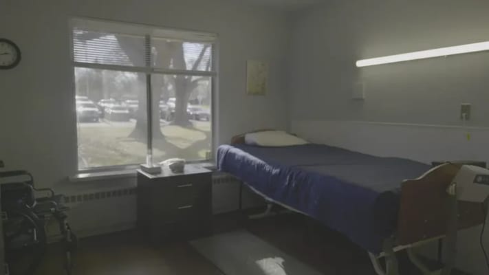 Private resident room with bed and window