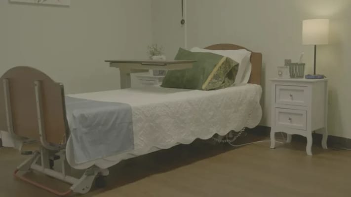 Cozy private room with a bed and lamp