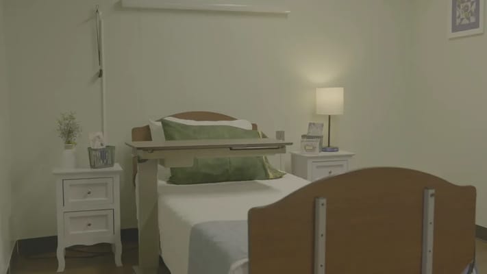 Cozy private resident room with a bed and nightstand