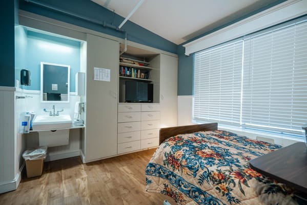 Cozy resident room with a bed and window