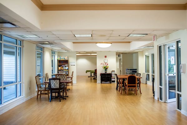 Bright common area with tables and chairs
