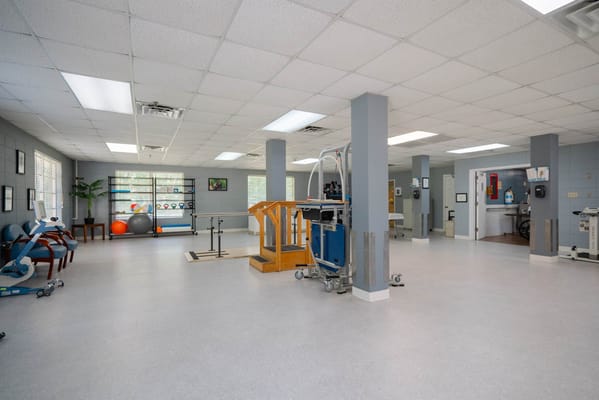 Bright interior of a physical therapy room with equipment