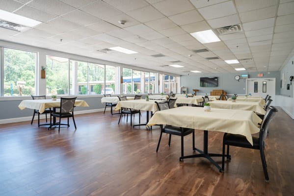 Bright dining room with tables and chairs