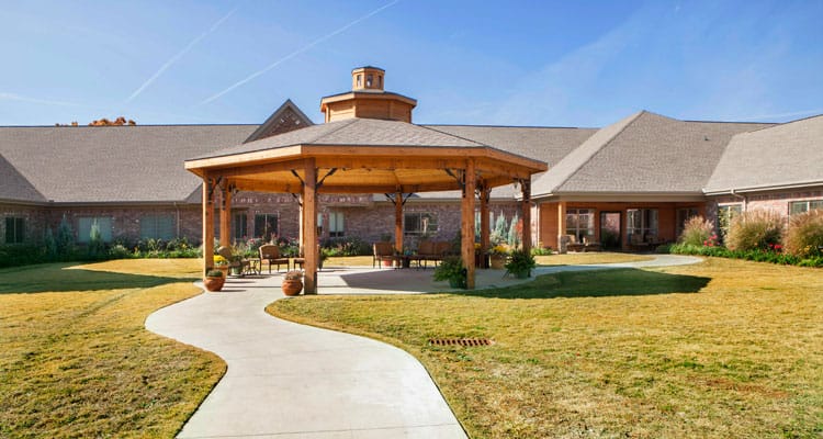 Outdoor seating area with pergola and pathway