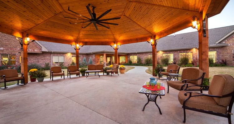 Covered outdoor seating area with comfortable chairs