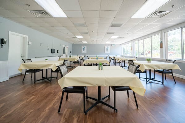 Bright dining area with tables set for meals