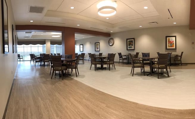 Bright dining area with tables and chairs