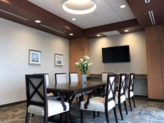 Bright dining area with a large table and chairs