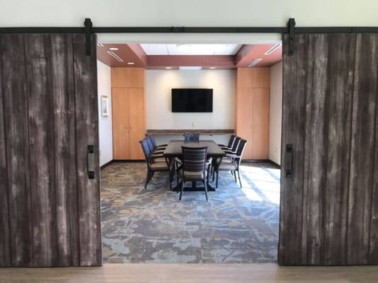 Interior view of a meeting room with a table and chairs