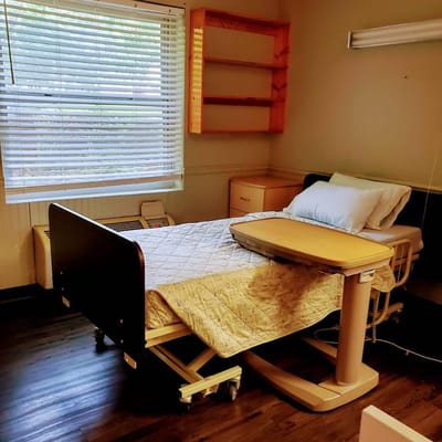 Private resident room with a hospital bed