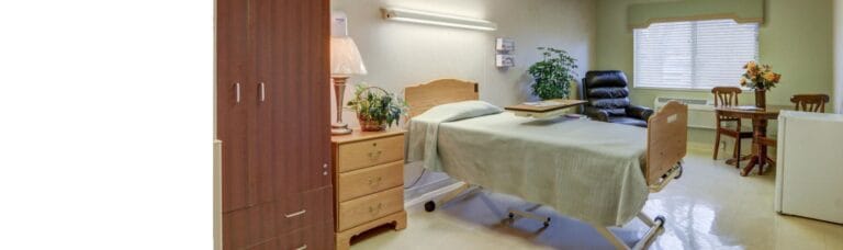 Private resident room with a bed and seating area