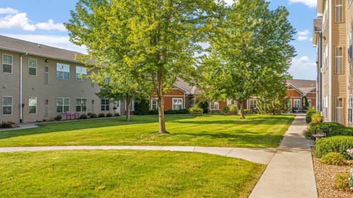 Well-maintained courtyard with lush greenery and pathways