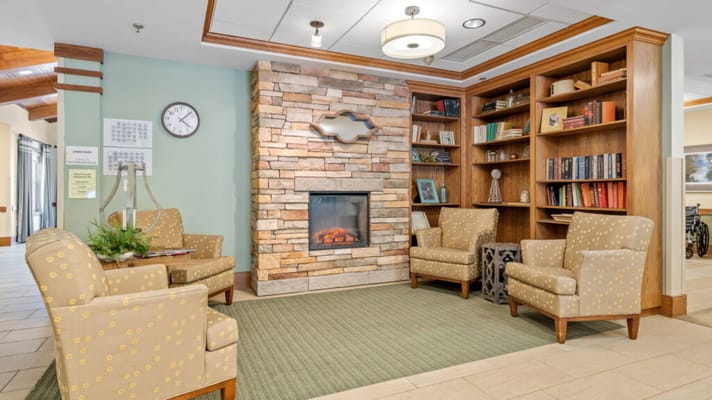 Cozy lobby area with seating and a fireplace