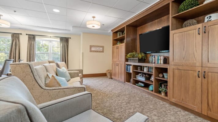 Common area with seating and bookshelves