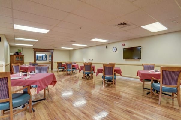 Dining area set up with tables and chairs