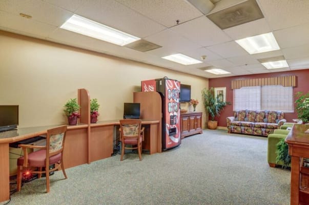 Bright common area with seating and computers