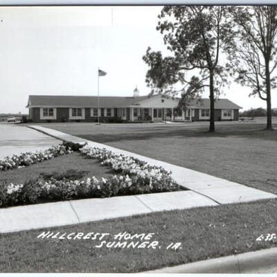 Exterior view of Hillcrest Home with landscaping