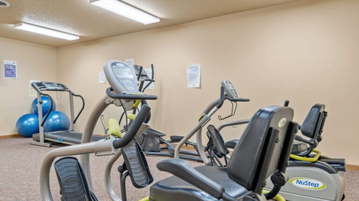 Interior view of a fitness area with exercise machines