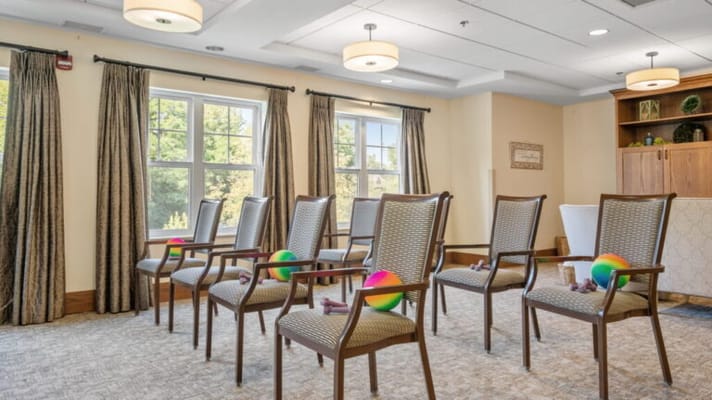 Activity room with exercise equipment and chairs