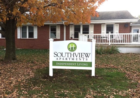 Sign for Southview Apartments with autumn trees