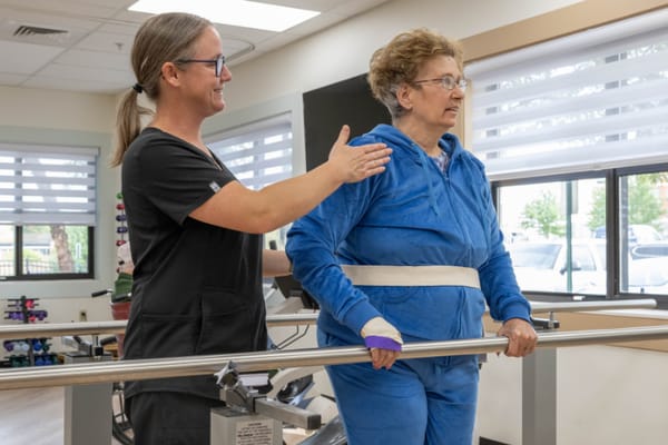 Therapist assisting a resident with balance training