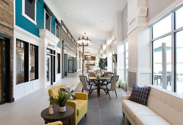 Bright interior of a community common area with seating