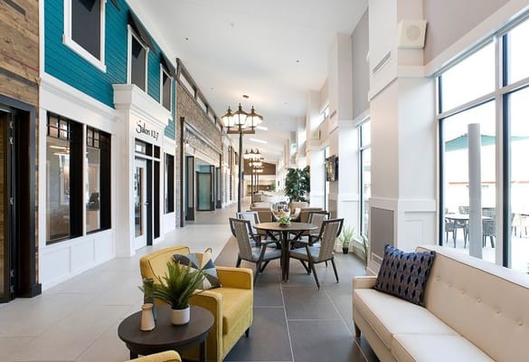 Bright interior of a community common area with seating