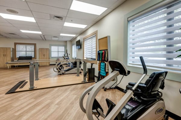 Interior photo of a spacious fitness area with equipment