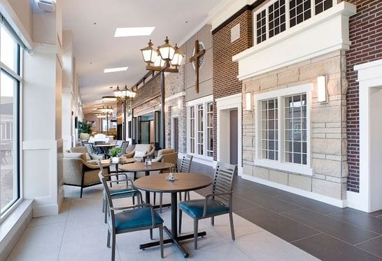 Bright common area with seating and decorative lamps