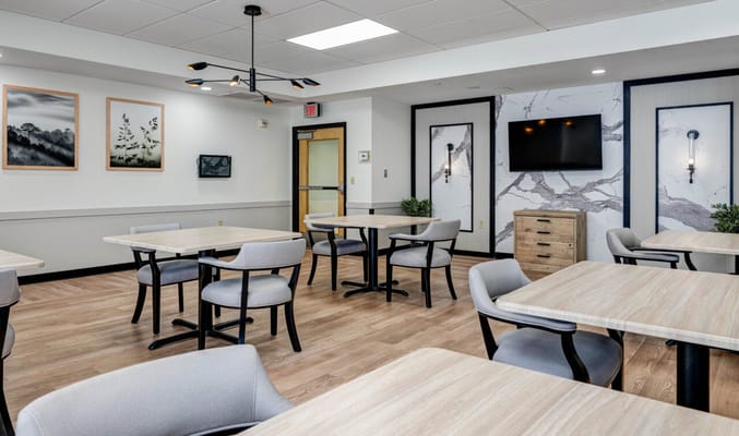 Bright communal dining area with modern furniture