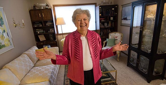 A senior woman smiling in her living room