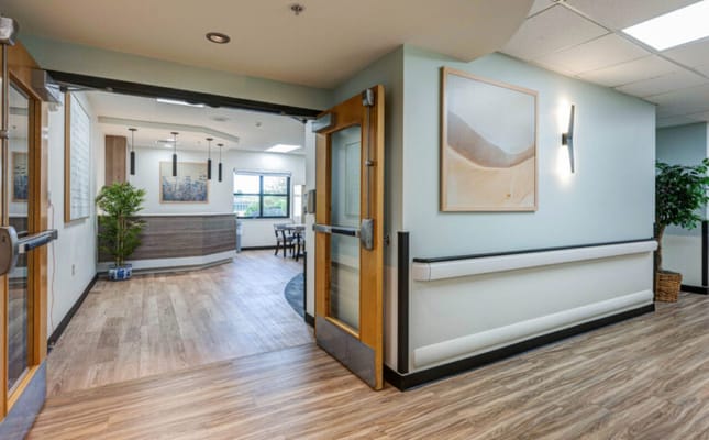 Bright interior hallway leading to a common area