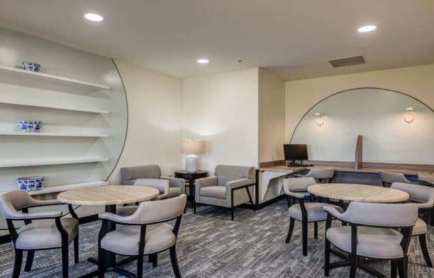 Interior common area with seating and a computer station