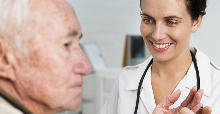 Nurse interacting with an elderly patient in a care facility
