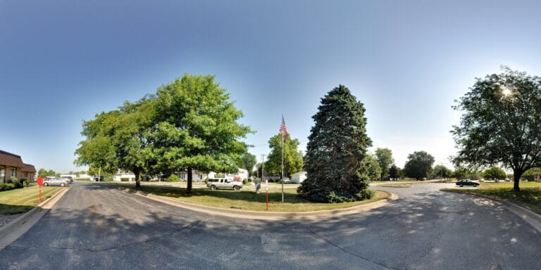 Outdoor area with trees and American flag