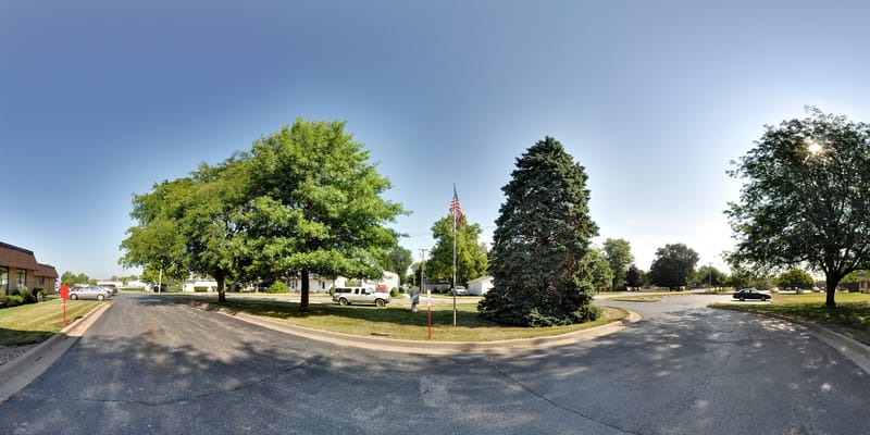 Outdoor area with trees and American flag