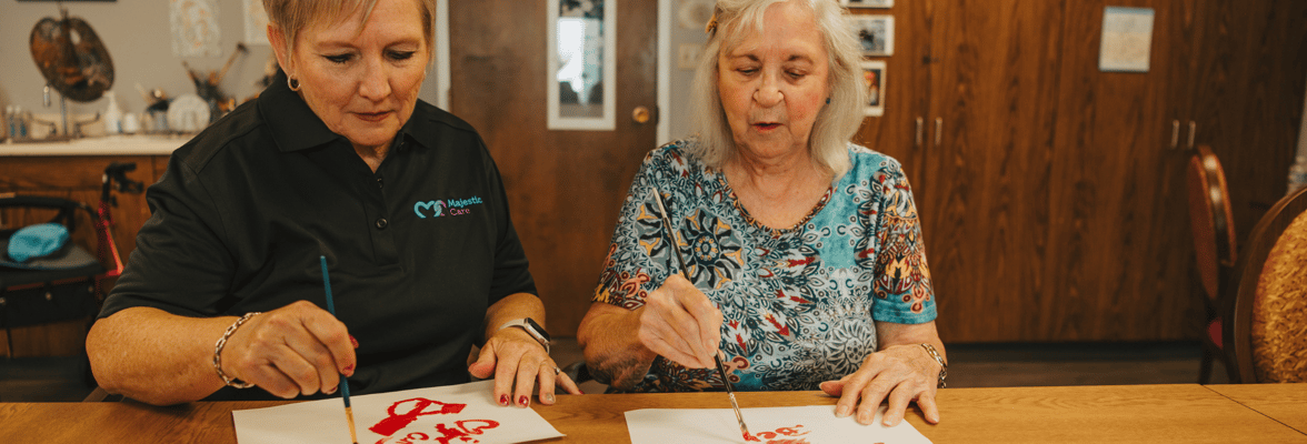 Residents and staff engaged in an art activity