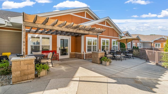 Outdoor patio area with seating and shade