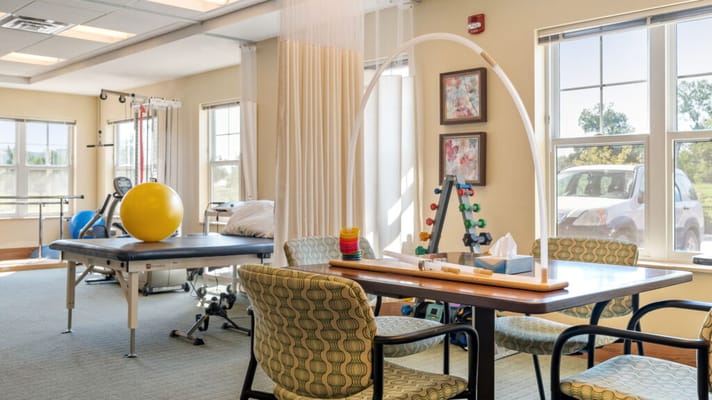 Interior therapy room with equipment and seating