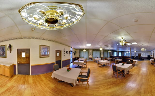 Bright dining room with tables and chandeliers
